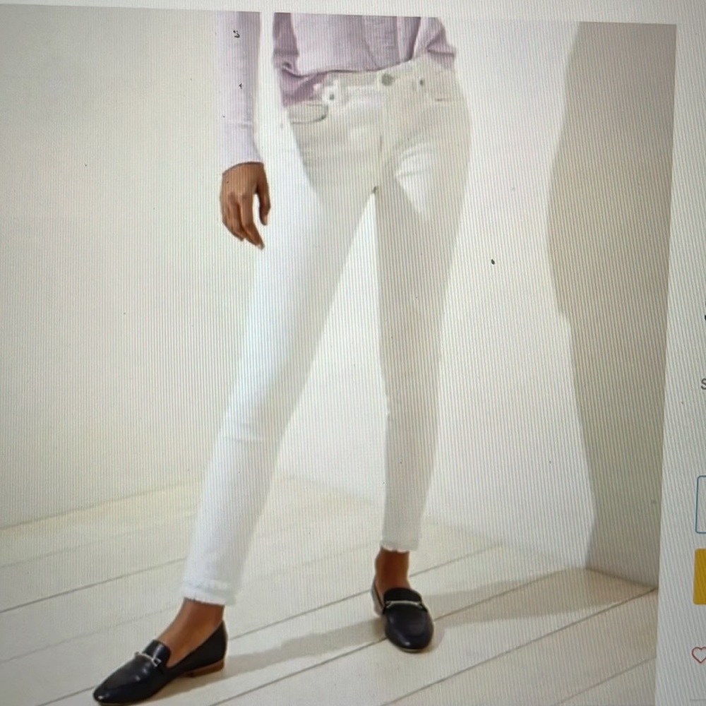 Loft white skinny jeans, with double fringe on bottom pant leg